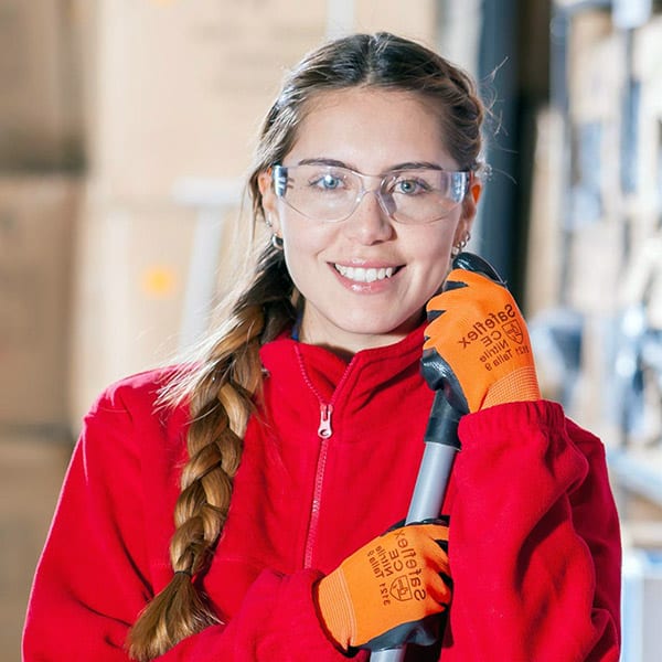 Separovic Injury Lawyers' employee holding an industrial equipment and wearing eye safety, safe from personal injury